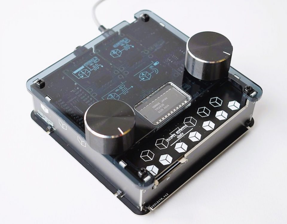 DAFM synth GENESIS by Kasser Synths with a Yamaha YM3438 chip visible through its clear acrylic window