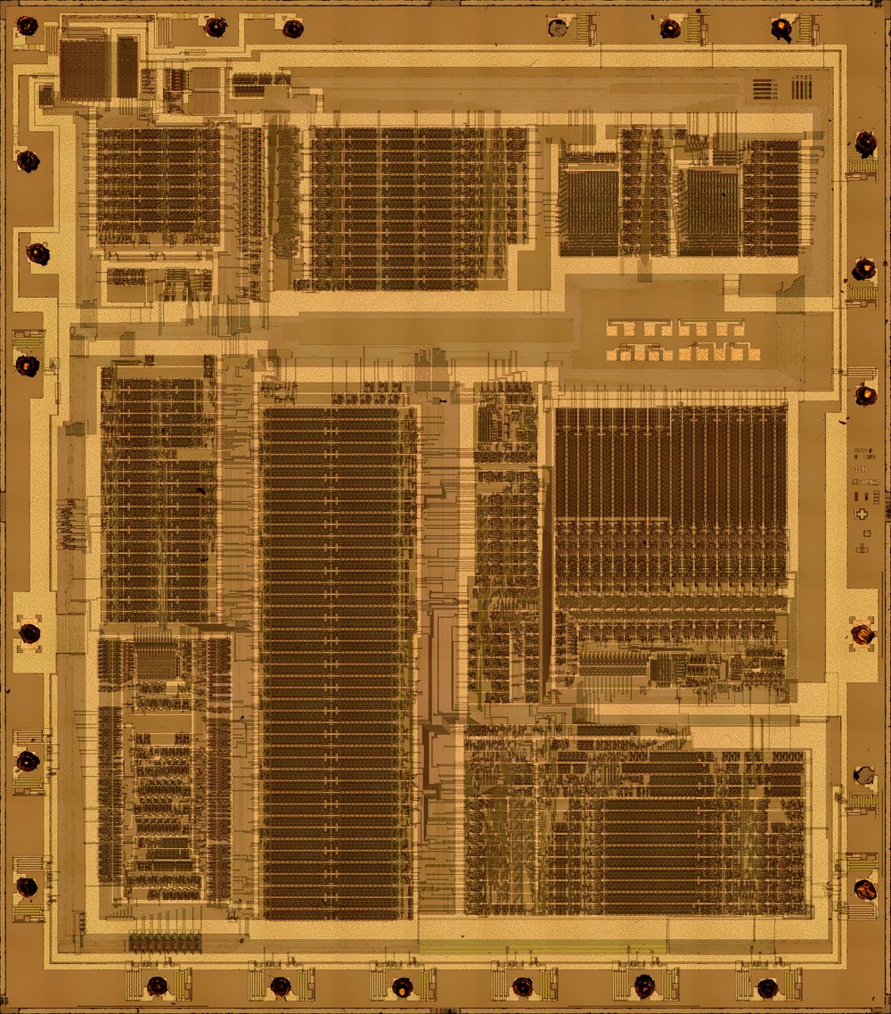 Top metal layer of the Yamaha YM2612 FM chip die, with its blocks of circuitry and bond pads around the edge